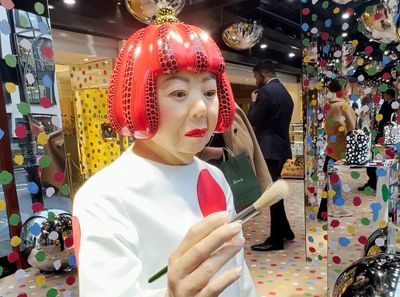 A Yayoi Kusama robot is painting the windows of this NYC Louis Vuitton store