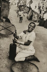 Woman Grinding Snuff in the Breezeblocks, South Africa by Dan Weiner contemporary artwork photography