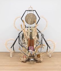 Guadalupe Maravilla, Disease Thrower - Purring Monster with a Mirror on Its Back (2022). Gong, steel, wood, cotton, glue mixture, plastic, loofah, and objects collected from a ritual of retracing the artist's original migration route. 302.3 x 266.7 x 241.3 cm. Courtesy the artist and P·P·O·W, New York. Photo: JSP Art Photography.Image from:The 14th Gwangju Biennale Repeats Planetary Themes for a ReasonRead FeatureFollow ArtistEnquire