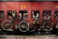 Bicycles on Side of Train, India by Steve McCurry contemporary artwork print