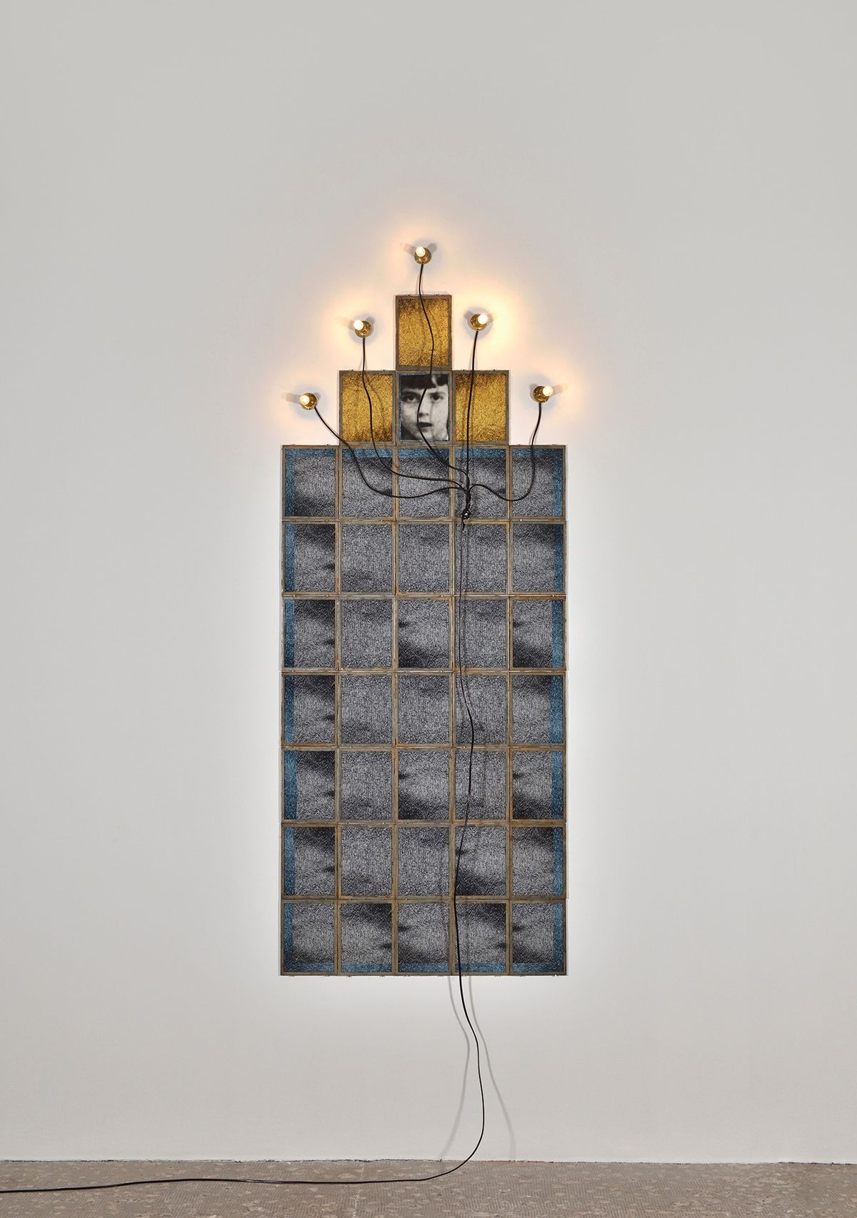 Monument, 1986 by Christian Boltanski, 39 frames, 5 sockets, 5