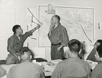 Classroom at Camp Hale with CIA instructor Ken Knaus and interpreter Thinley Palijorm, early 1960s. Courtesy Bruce Walker, Hoover Institution.
