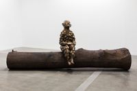 Bumpman on a tree trunk by Paloma Varga Weisz contemporary artwork sculpture