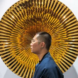 Portrait of Thang Do with their work.Courtesy West Space.