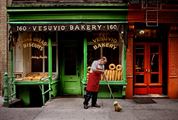 A man sweeps outside a bakery, New York, NY, USA by Steve McCurry contemporary artwork 1