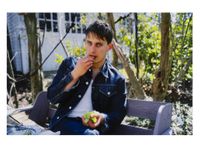 Clemens eating grapes under my arbor, Sag Harbor, NY by Nan Goldin contemporary artwork photography
