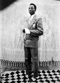 Untitled (Man with white gloves) by Seydou Keïta contemporary artwork photography