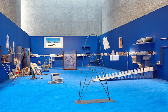 Camille Henrot, The Pale Fox, 2014 - 2015. Installation (aluminium, bronze, prints, drawings, with found objects and soundtrack). 2,300 x 900 cm; 905 1/2 x 354 1/3 in. Exhibition view at KÖNIG GALERIE.
