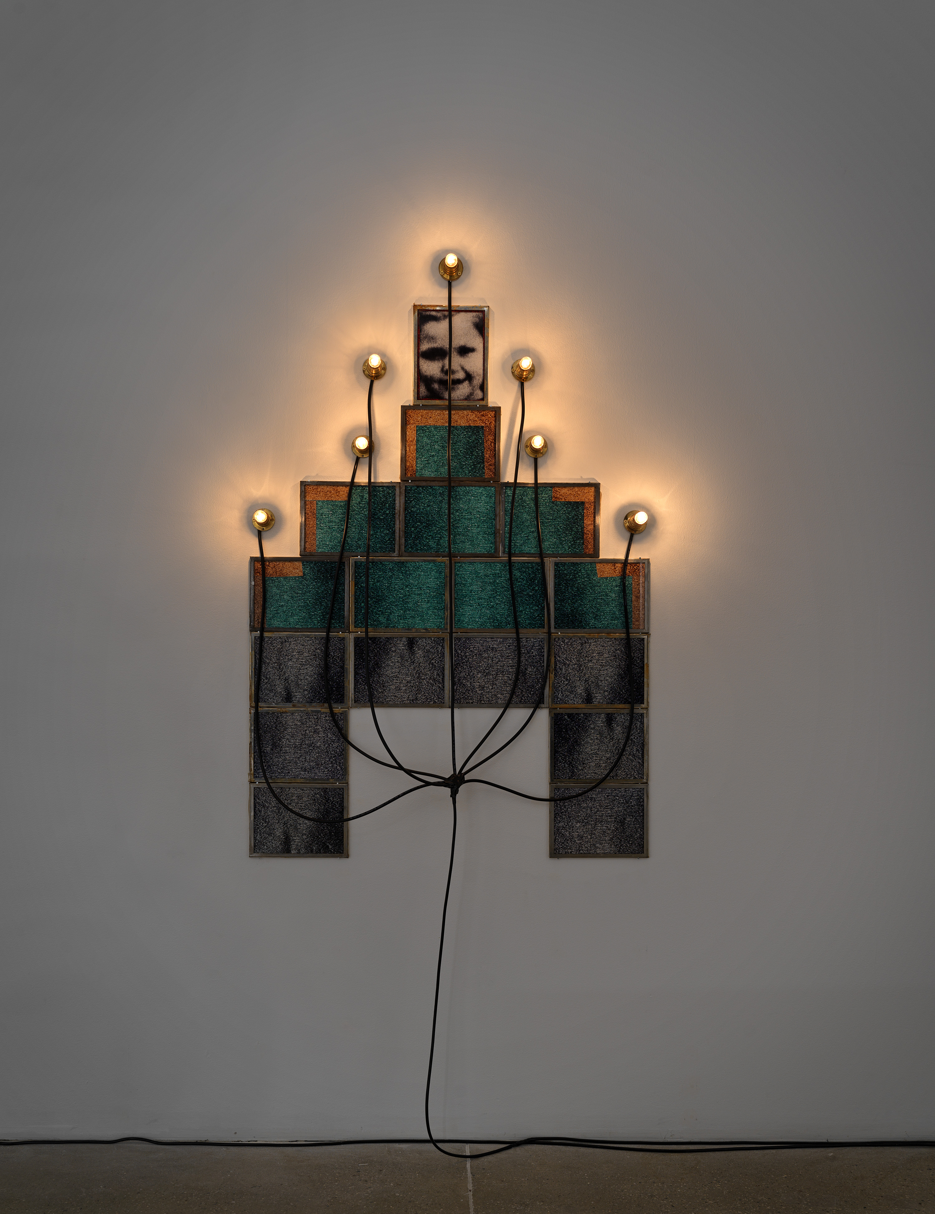 Monument, 1986 by Christian Boltanski, 17 framed photographs, 7