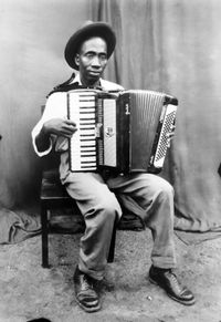 Untitled (Man With Accordion) by Seydou Keïta contemporary artwork photography