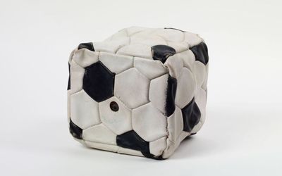 Fabrice Hyber, POF 65 - ballon carré (1998). Leather. 21 x 21 x 21 cm. Courtesy Dumonteil Contemporary, Paris.