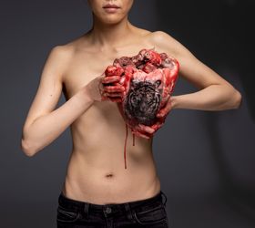 Cao Yu, The Thing in the Chest (2020). C-print (bull's heart, tiger head tattoo, the artist). 160 × 179 cm. Courtesy the artist and Galerie Urs Meile, Beijing-Lucerne.