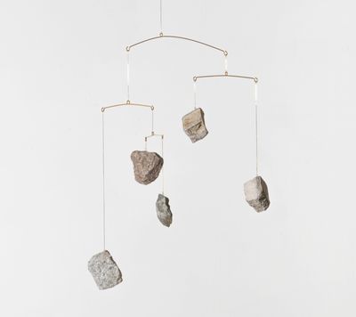 Alicja Kwade, Rocking (2021). Brass, stones. 110 x 52 x 52 cm.