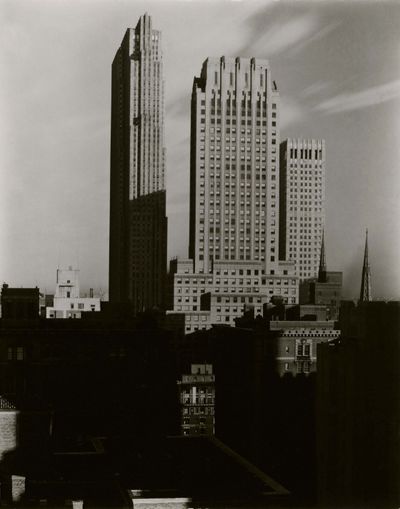 Alfred Stieglitz, New York, from the Shelton (1935). Gelatin silver contact print on warm-toned paper, printed and mounted by the photographer in New York (1935). 24.1 x 19.1 cm.