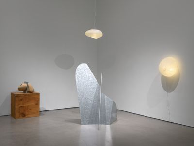 Isamu Noguchi, Transformation Stone (1982); Mountains Forming, 1982–1983 (2020), two Akari 16A 'Environment', White Cube Art Basel Hong Kong (21–23 May 2021). © INFGM/ARS. Photo: © White Cube (Dan Bradica).