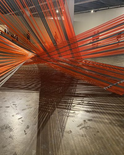 Exhibition view: Mata Aho Collective, Tuakirikiri (2023). Polyester webbing. Dimensions variable.