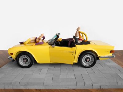 Sarah Lucas, SIX CENT SOIXANTE SIX (2023). Triumph TR6 car, tights, wire, wool, shoes, acrylic paint, wigs, overall. 207 x 400 cm.