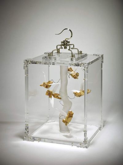 Kum Chi-Keung, Amusement Park (2012). Acrylic box, bamboo, feather, stainless steel with stand. 38 x 22 x 22 cm.
