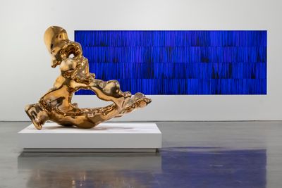 Left to right: Lindy Lee, Open as the Sky (2020). mirror polished bronze; Under the Shadowless Tree (2020). Synthetic polymer paint, beeswax, oil on Alucabond. Exhibition view: Lindy Lee: Moon in a Dew Drop, Museum of Contemporary Art Australia, Sydney (2 October 2020–28 February 2021).