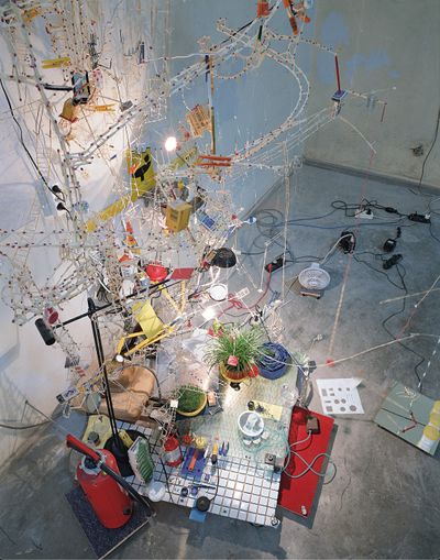 Sarah Sze, Second Means of Egress (1998). Mixed media. Dimensions variable. Exhibition view: 1st Berlin Biennale (28 September 1998–3 January 1999). © Sarah Sze.