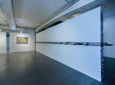 Lam Tung-pang, Saan Dung Gei Turns (2019). HO-scale and N-scale train model, acrylic sheet, plywood, charcoal, and ink. 230 x 670 x 30 cm. Exhibition view: Saan Dung Gei, Blindspot Gallery, Hong Kong (26 March–11 May 2019). Courtesy Blindspot Gallery.