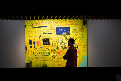Jean-Michel Basquiat, Hollywood Africans (1983). Exhibition view: Basquiat: Boom for Real, Barbican Art Gallery, London (21 September 2017–28 January 2018). Courtesy Whitney Museum of American Art, New York. © The Estate of Jean-Michel Basquiat/Artists Rights Society (ARS), New York/ADAGP, Paris. Licensed by Artestar, New York. Photo: © Tristan Fewings / Getty Images.