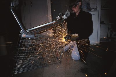Inga Svala Thórsdóttir pulvarising a shopping trolley in 1993 as part of ‘Thor’s Daughter’s Pulverization Service’ (1993–ongoing). Courtesy the artist.