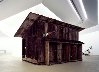 Simon Starling, Shedboatshed (Mobile Architecture No. 2), (2005). Rebuilt wooden shed, paddle, 390 x 600 x 340 cm. Exhibition view: Museum für Gegenwartskunst, Basel, (2005).