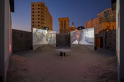Tuấn Andrew Nguyễn, The Specter of Ancestors Becoming (2019). 4-channel video installation: colour, 7.1 surround sound; inkjet on canvas, oil on canvas, graphite on paper, C-prints, sand. 28 min; dimensions variable. Commissioned by Sharjah Art Foundation. Produced by Sharjah Art Foundation with the additional production support from the San Francisco Museum of Modern Art. Exhibition view: Leaving the Echo Chamber, Sharjah Biennial 14 (7 March–10 June 2019). Courtesy the artist. Photo: Sharjah Art Foundation.