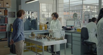 Film still two woman facing each other in laboratory