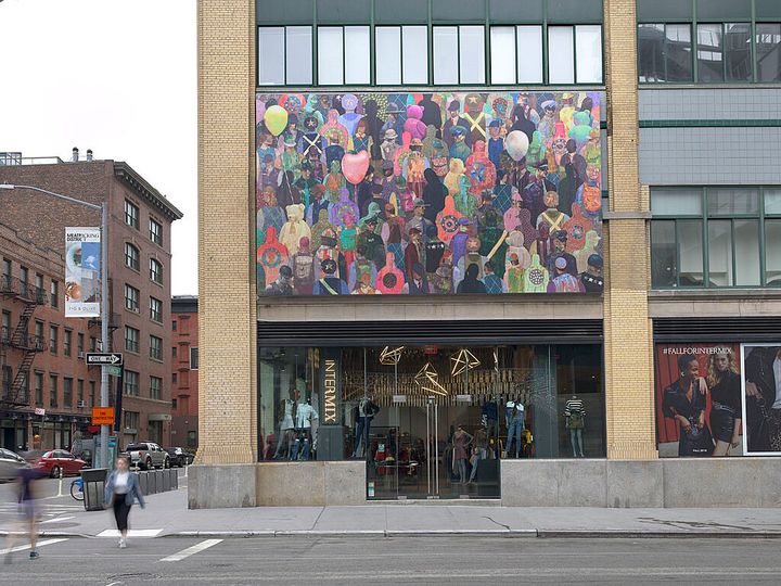 A mural by Derek Fordjour on the outside of the Whitney Museum of American Art shows a crowd of people, their clothing in varying shades of class=