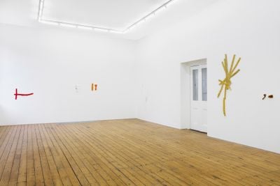 Subtle, fragmentary textile works by Hana Miletić hang in a white gallery space.