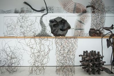 Shelves with welded steel sculptures of varying size
