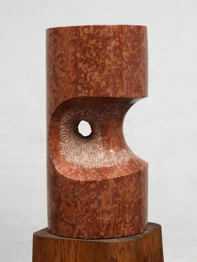 Cylindrical Verona red marble sculpture hollowed and punctured