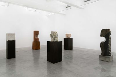 Five sculptures on exhibition mounted on wood concrete and stone