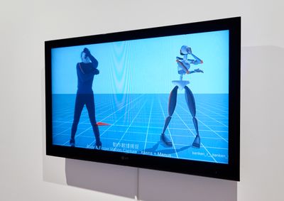 A screen in the gallery space shows motion-capture footage of the artist Lu Yang.