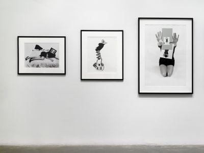 Three black and white portraits of women in different poses sit in a row of three, framed in black.