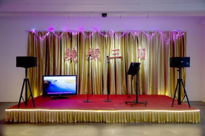 Mak2, Sound of Music (2017). Dual channel video, audio set, red carpet, gold drapes, foam lettering, LED lights, disco ball. Dimensions variable. © Mak2.