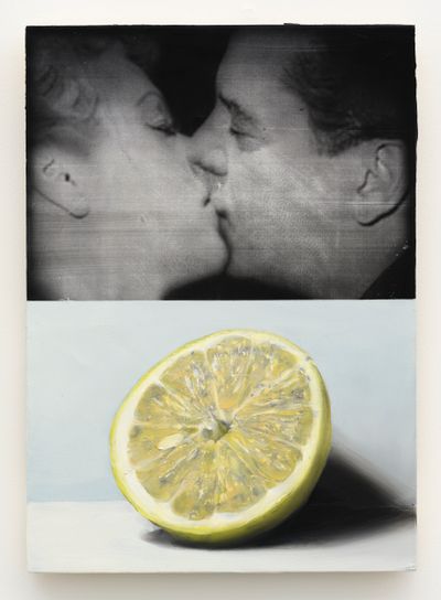 A realistic black-and-white painting resembling a fill still captures two people kissing at the top of a vertical canvas. At the bottom, half a lemon has been painted against a grey background.