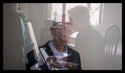 Translucent superimposed images showing an elderly man faded against a second sitting at the piano.  