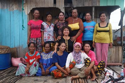 Artist Yee I-Lann is pictured with her collaborators: a group of women from the island of Sabah in Borneo.