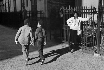 Dawoud Bey, A Woman and Two Boys Passing (1978). Photograph from 'Harlem, U.S.A.' series. © Dawoud Bey.