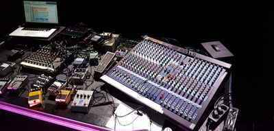 Hassan Khan's live worktable in preparation for his concert at the 2017 edition of the Intonal Music Festival in Malmö. Two systems are being mixed: the pre-composed and pre-recorded material from the studio with the small feedbacking mixer.