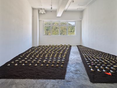 Jaffa Lam, Taishang LaoJun's Furnace (2022). Bronze, concrete, and recycled aluminium from boat engine, recycled umbrella fabric, Hong Kong recycled soil. Dimensions variable. Exhibition view: Chasing an Elusive Nature, Axel Vervoordt Gallery, Hong Kong (15 October 2022–7 January 2023).