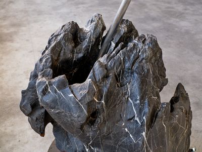 Jaffa Lam, Somersault Cloud (2022) (detail). Abandoned scholar's rock, metal, recycled wood, and wheels. 320 x 250 x 210 cm. Exhibition view: Chasing an Elusive Nature, Axel Vervoordt Gallery, Hong Kong (15 October 2022–7 January 2023).
