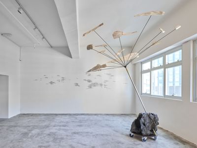 Jaffa Lam, Somersault Cloud (2022). Abandoned scholar's rock, metal, recycled wood, and wheels. 320 x 250 x 210 cm. Exhibition view: Chasing an Elusive Nature, Axel Vervoordt Gallery, Hong Kong (15 October 2022–7 January 2023).