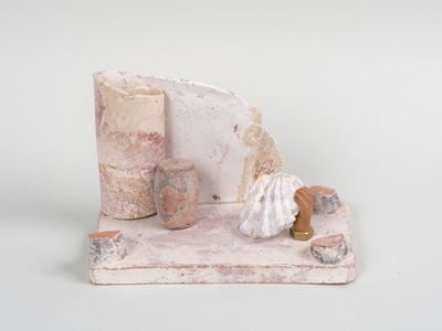 Leelee Chan, Prologue 序幕 (2021). Tang dynasty (618–907) Chinese pottery fragment, found seashell, brass hex nuts, clay, pigment. 11.5 x 17 x 9 cm. © Leelee Chan.
