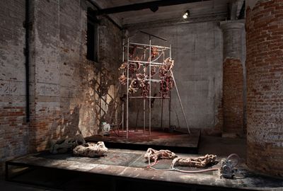 Mire Lee, Endless House: Holes and Drips (2022). Multiple ceramic sculptures on a scaffold, lithium carbonate and iron-oxide glaze liquid, pump, motor, and mixed media. 1.8 x 2 x 4 m. Exhibition view: The Milk of Dreams, 59th International Art Exhibition – La Biennale di Venezia (23 April–27 November 2022).