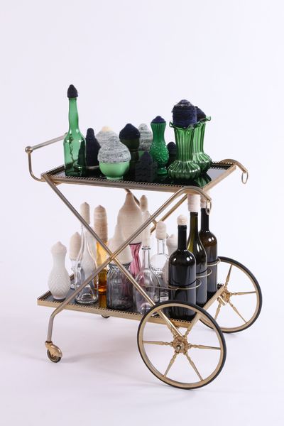 Pinaree Sanpitak, The Affairs of Serving (2020–2021). Mulberry paper, needle, and found objects. Dimensions variable, set of 18 trolleys.