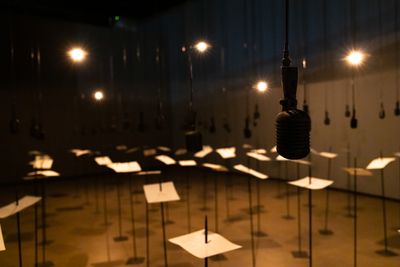 Shilpa Gupta, For, In Your Tongue, I Cannot Fit (2017–2018). Sound installation with 100 speakers, microphones, printed text, and metal stands. Exhibition view: Shilpa Gupta, Sun at Night, The Curve, Barbican Centre (7 October 2021–6 February 2022). © Tim Whitby/Getty Images.